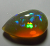 4.80 / Cts - 10x16.5 mm - Pear Cut Cabochon - WELO ETHIOPIAN OPAL - Amazing Green Red Mix Fire